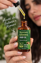 Aplicación del aceite de romero y batana con gotero sobre el cabello